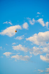 Fototapeta na wymiar Balloon in the clouds