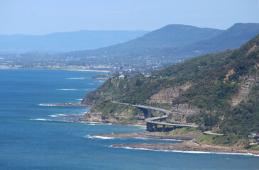 A view looking out to Sea Cliff Bridge which extends along the Grand Pacific Drive a 140 kilometre coastal drive