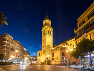 Fototapeta na wymiar La Encarnación square at night, with Parroquia de San Pedro Apóstol church in the background