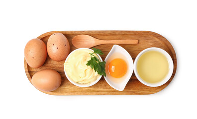 Bowl with tasty mayonnaise sauce and ingredients on white background