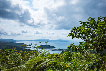 Fototapeta na wymiar 沖縄・大宜味村六田原展望台から見える青空と海の風景