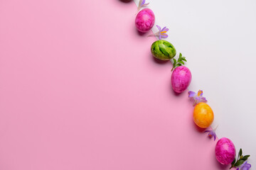 Row of Easter eggs and beautiful crocus flowers on colorful background