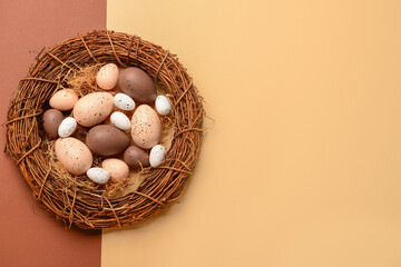 Wreath with Easter eggs on brown and beige background