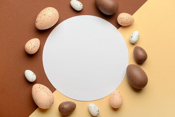 Fototapeta na wymiar Blank greeting card with Easter eggs on brown and beige background