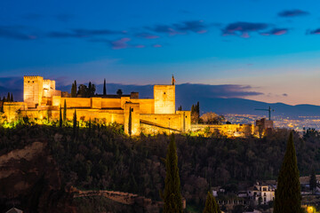 Fototapeta na wymiar View of alhambra with mountain sierra Nevada on the background by sunset