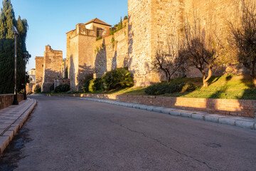 The walls of Alcazaba by sunrise in Malaga, Spain