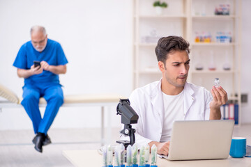 Fototapeta premium Two male chemists in drugs synthesis concept