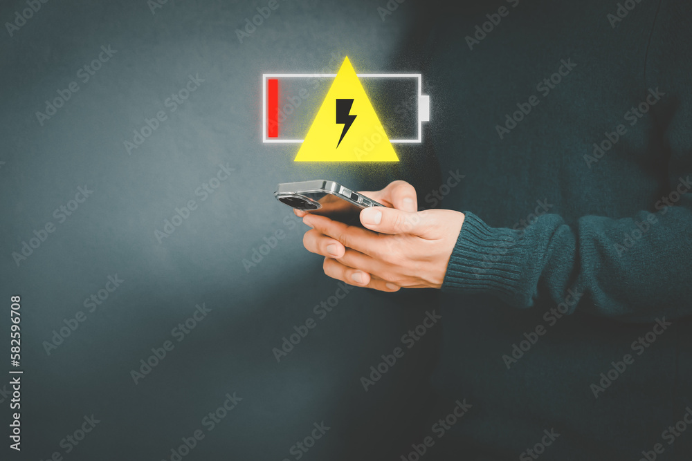 Aufkleber young man is angry and frustrated when he learns that his the smartphone's battery is dead and did n