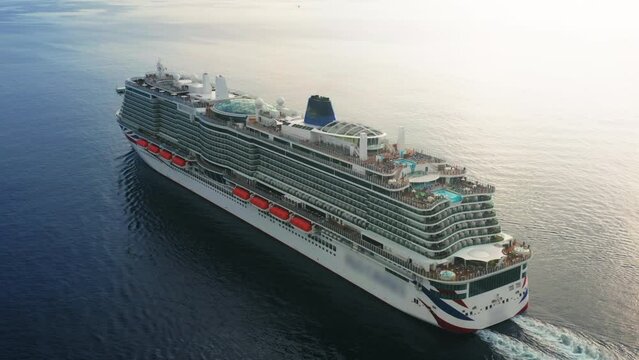 Aerial view of a cruise ship sailing the ocean or sea on a sunny summer day