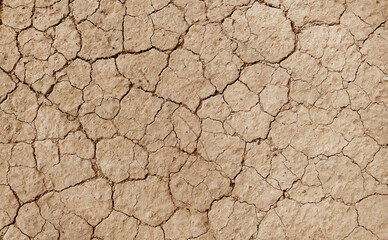 Cracked ground background in the top view for graphic design or wallpaper