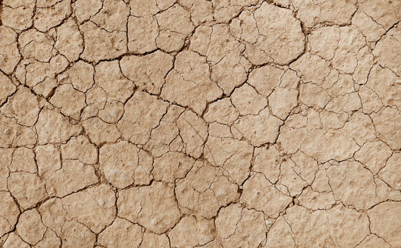 Cracked ground background in the top view for graphic design or wallpaper