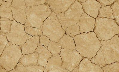 Cracked ground background in the top view for graphic design or wallpaper
