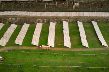 Farmers dry rice paper in the field, a step after making rice paper in An Nhon Town, Binh Dinh province, Vietnam