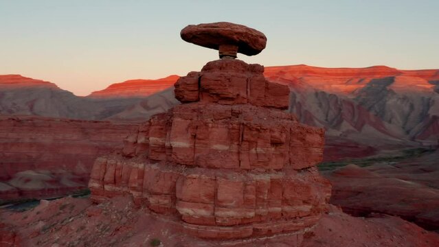 Aerial shot of the incredible balancing Mexican Hat rock formation in Southern Utah.