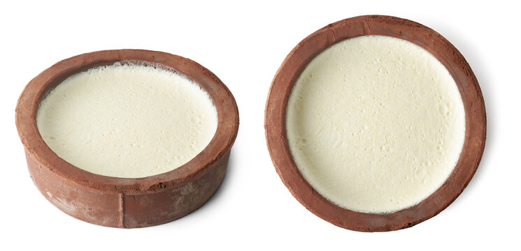 set of homemade curd in clay pot or container, thick yogurt or milk product in earthen clay pot or terracotta pot which makes less sour and turns sweeter, isolated