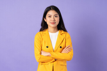 portrait of young businesswoman on purple background