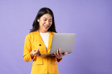 portrait of young businesswoman on purple background