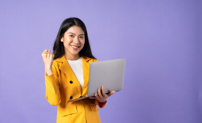 portrait of young businesswoman on purple background