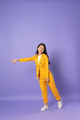 Fototapeta na wymiar portrait of young businesswoman on purple background