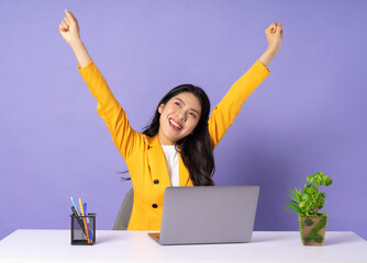 portrait of young businesswoman on purple background