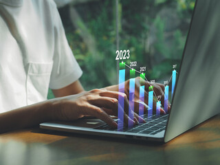 Positive indicators 2023, businessman calculating financial data for long-term investments in the coming year