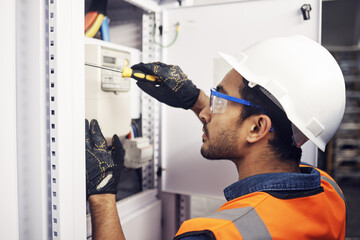 Man, electricity and screwdriver of maintenance box in control room, engineering or machine...