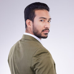 Obraz premium Portrait, business and Asian man with confidence, success and concentration against a studio background. Face, Japanese male employee and consultant with growth, leadership skills and management