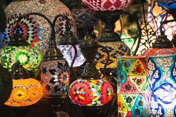 Middle Eastern lambas of different colors and sizes are hanging in the bazaar. Bright traditional...