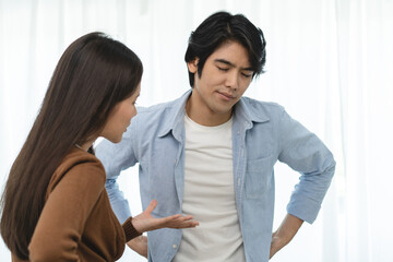 Family problems, Asian couple quarrel together at home. woman angry on man and man feel annoy.