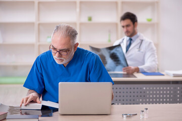 Two male doctors working in the clinic