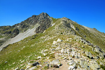 Mount Pic de Bastan in Neouvielle national nature reserve, department of Hautes-Pyrenees, Occitanie in south of France. Mountain landscape in sunny day.