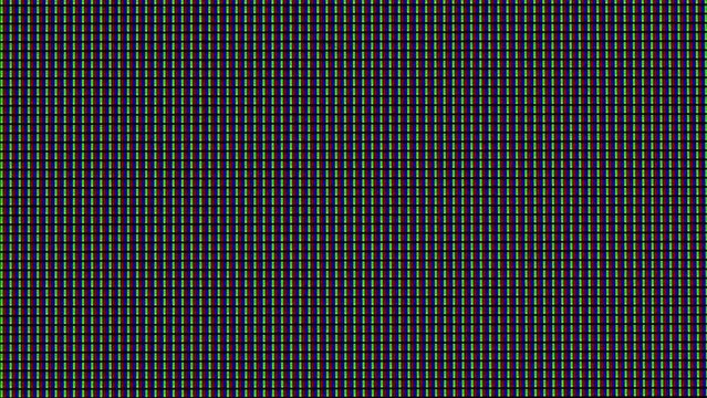RGB Multi-Colored Sub Pixels of LED Matrix of the TV in Extreme Macro. Rows of colored RGB sub-pixels create an abstract pattern. Extreme macro Red, blue, and green LED pixels of VA matrix of 4K TV.