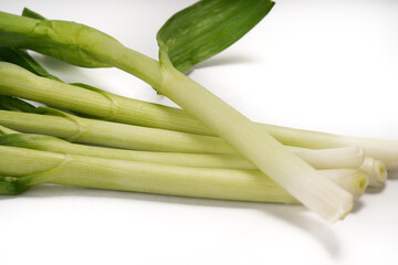 Green onions close-up on white background
