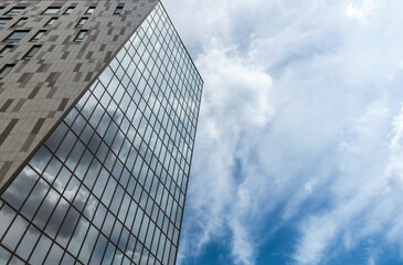 Fototapeta na wymiar Office building on a background of the blue sky
