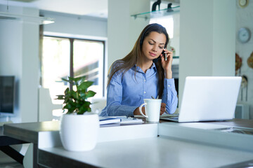 Female customer support operator with headset and smiling.