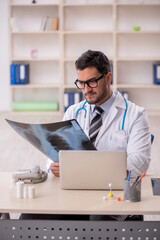 Young male doctor radiologist working in the clinic