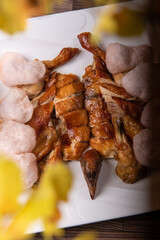 chef signature golden roasted crispy farm kampong whole chicken with deep fried kolopok on wood table Chinese asian halal banquet menu