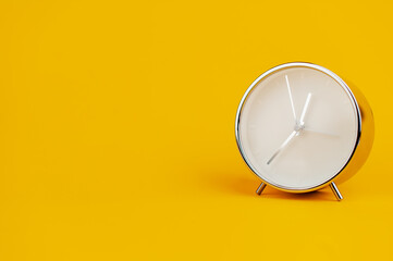 white clock on yellow background concept of time Time planning