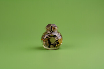 Savings in a glass bottle; savings; salary; income from work savings concept