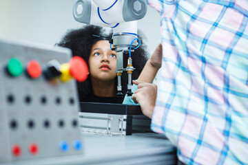 Kid-friendly experiments to education learning technology science robotics mechanics classes intelligent smart,Robotic Arm with remote control while testing his engineering wonder.