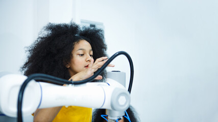 Cheerful ingenious children in robotics class in the classroom. Innovation technology and success concept