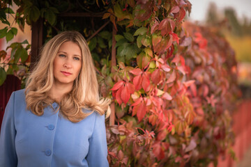 Portrait of a young beautiful blonde girl outdoors in spring.