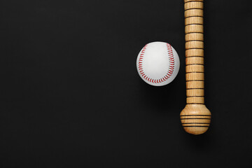 Wooden baseball bat and ball on black background, flat lay. Space for text