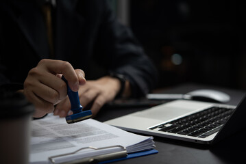 Businesspeople Signing Contract.Document Approval Signing with Stamping important document or the signing of an important legal document.