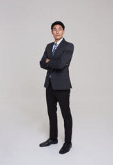 business, people good looking in studio. Full length Asian businessman in grey suit confident with...