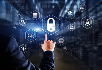 Businessman presses cybersecurity button on virtual screens