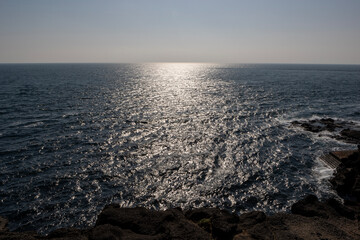 The open sea, the sky and the waves