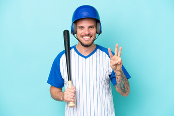 Baseball player with helmet and bat isolated on blue background happy and counting three with fingers