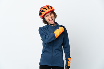 Young English cyclist woman isolated on white background celebrating a victory