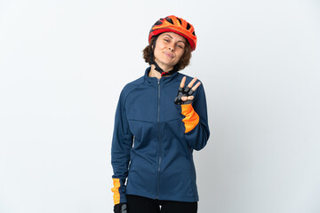 Young English cyclist woman isolated on white background happy and counting three with fingers